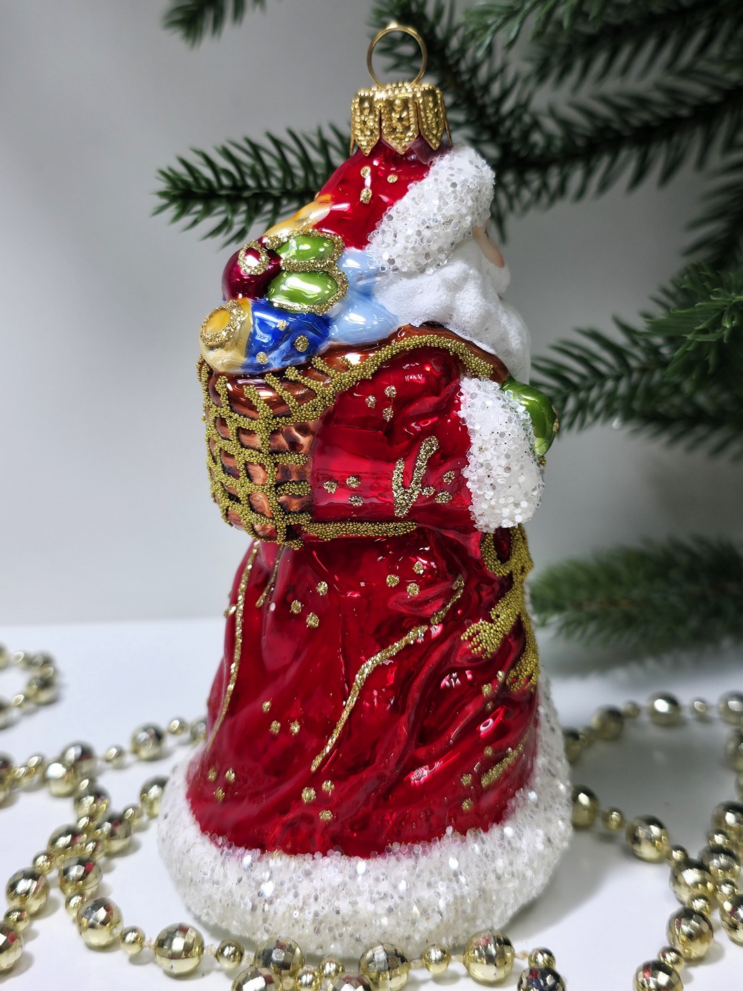 фото Стеклянная елочная игрушка Дед Мороз с подарками