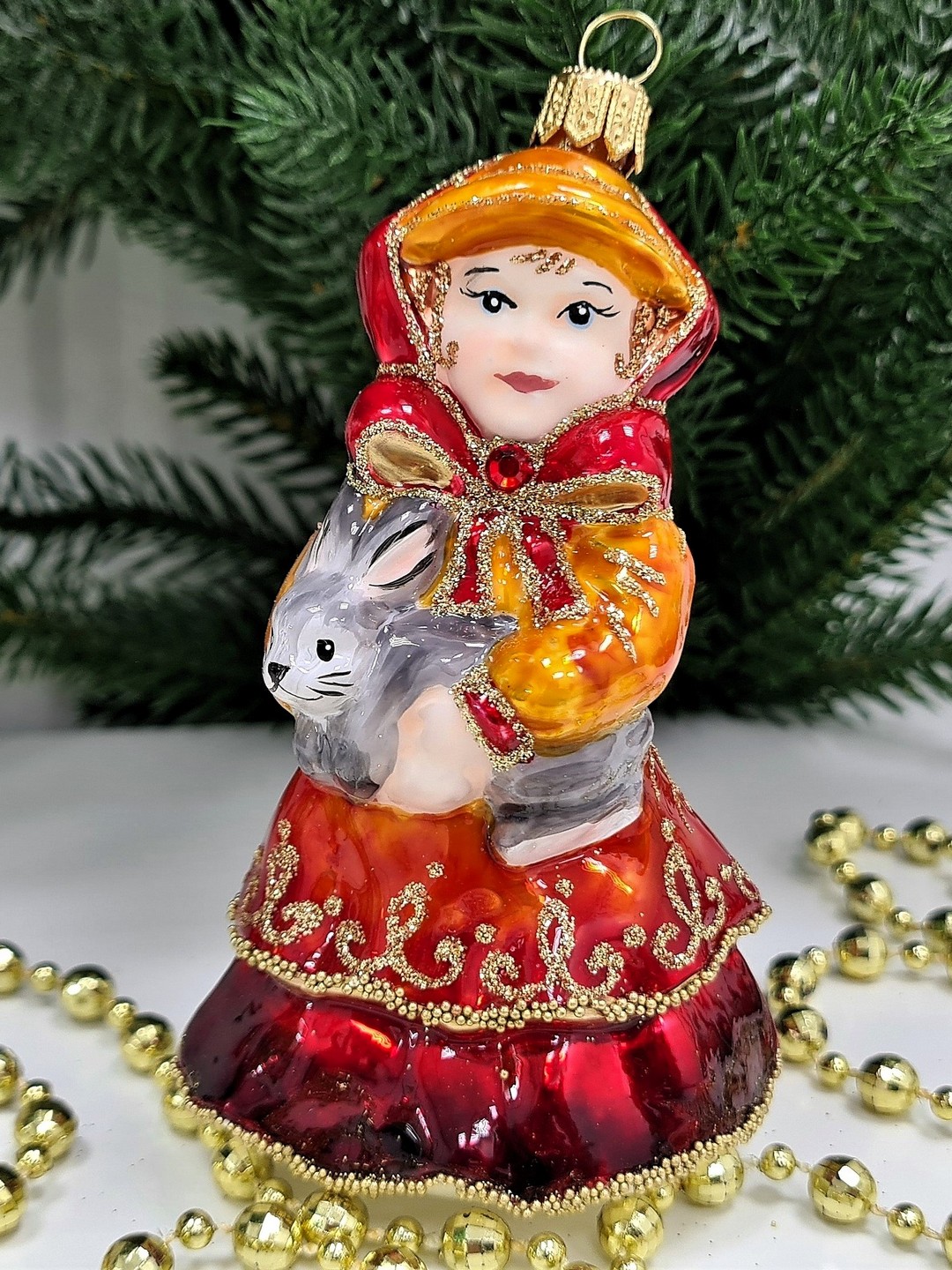 фото Стеклянная елочная игрушка Девочка с кроликом