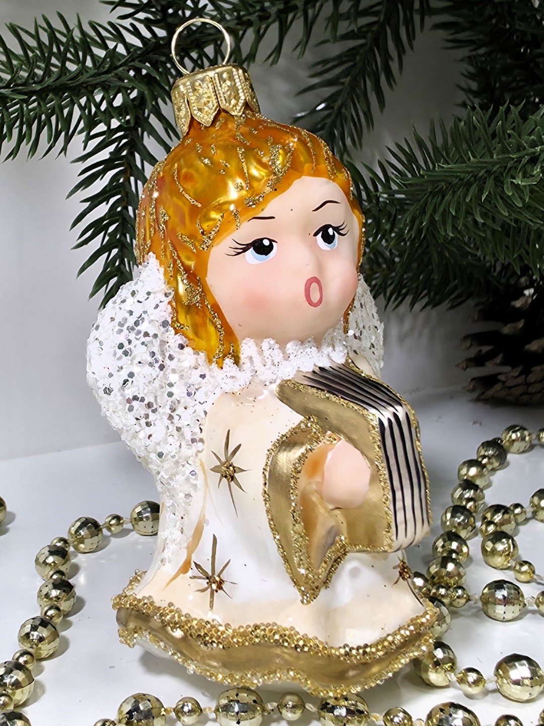 фото Стеклянная елочная игрушка Ангел с книгой