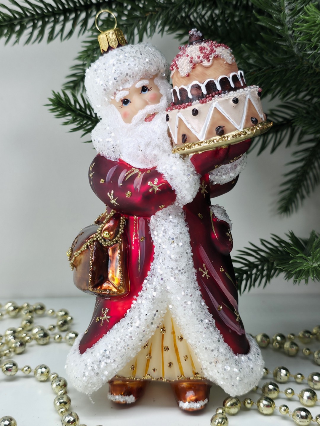 фото Стеклянная елочная игрушка Дед Мороз с тортом