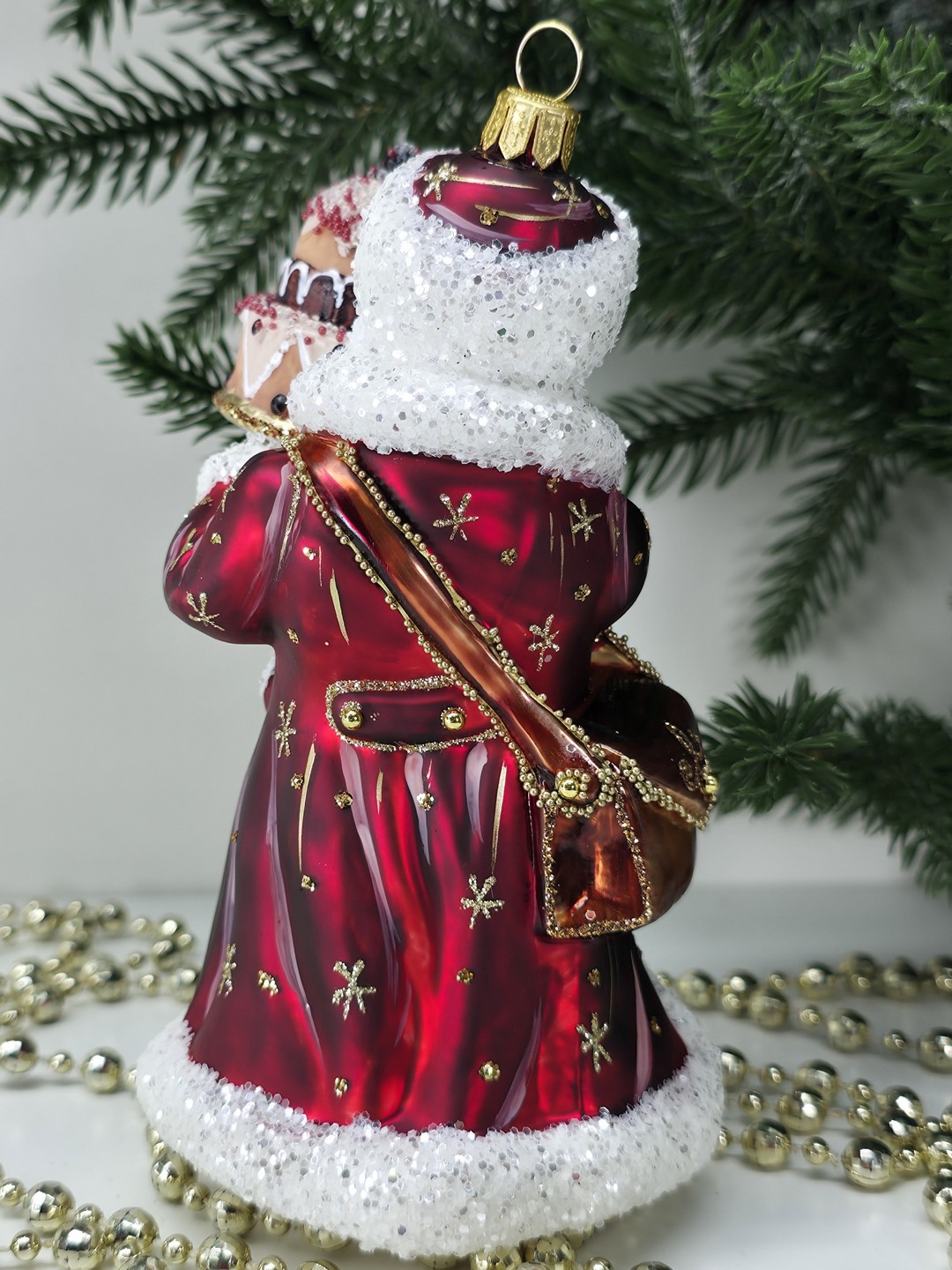 фото Стеклянная елочная игрушка Дед Мороз с тортом