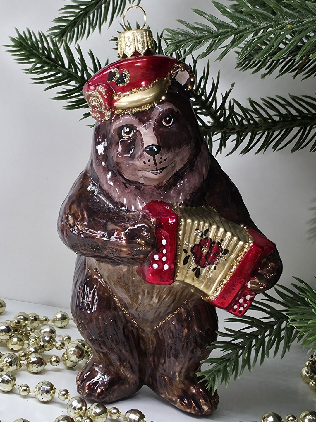 фото Стеклянная елочная игрушка Мишка с гармошкой