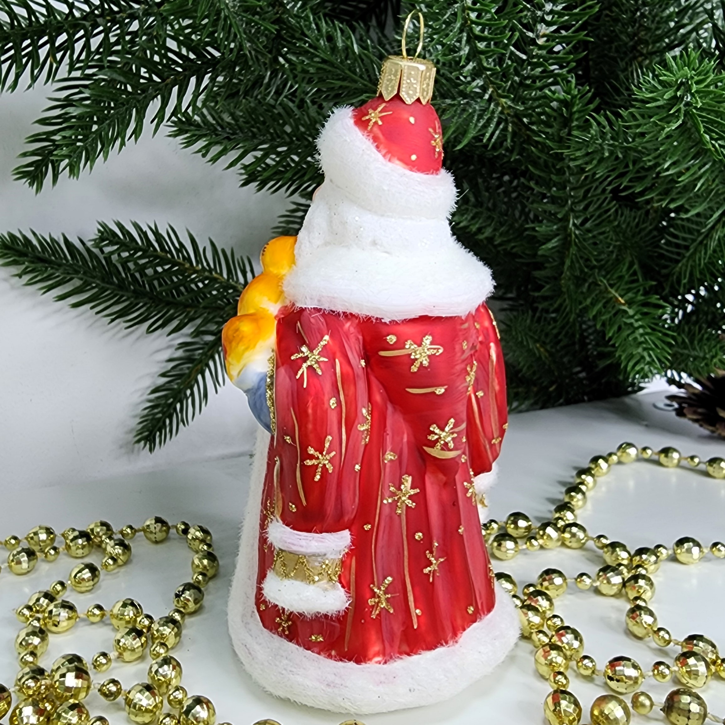 фото Стеклянная елочная игрушка Дед Мороз красный с белочкой