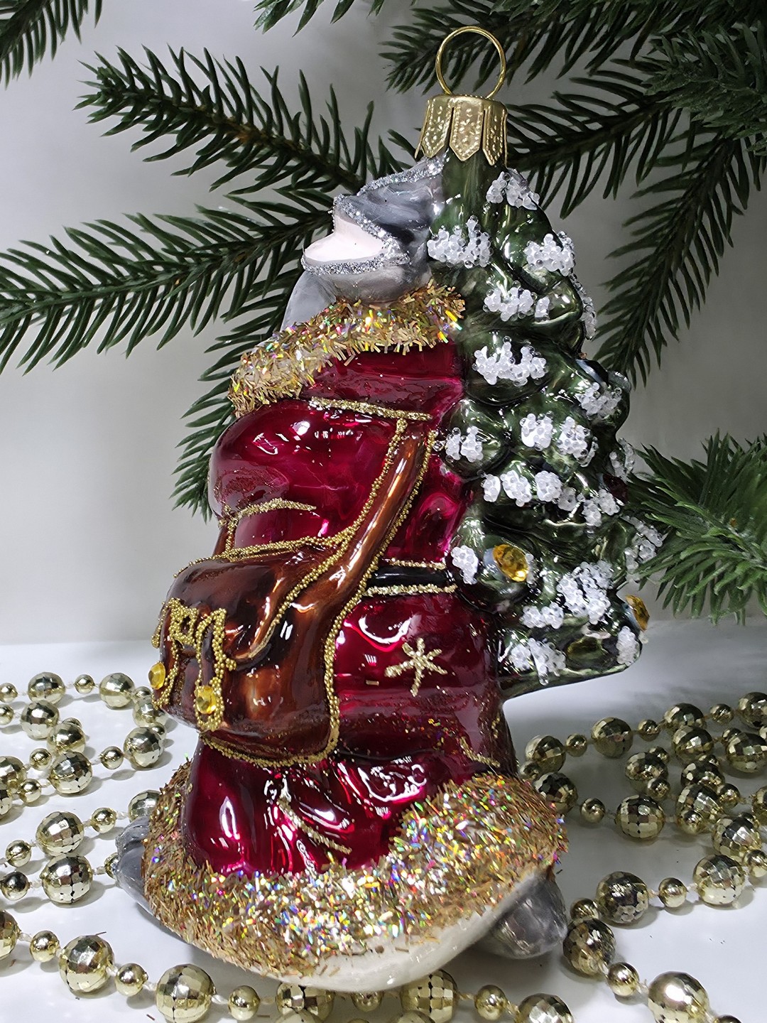 фото Стеклянная елочная игрушка Заяц с елкой