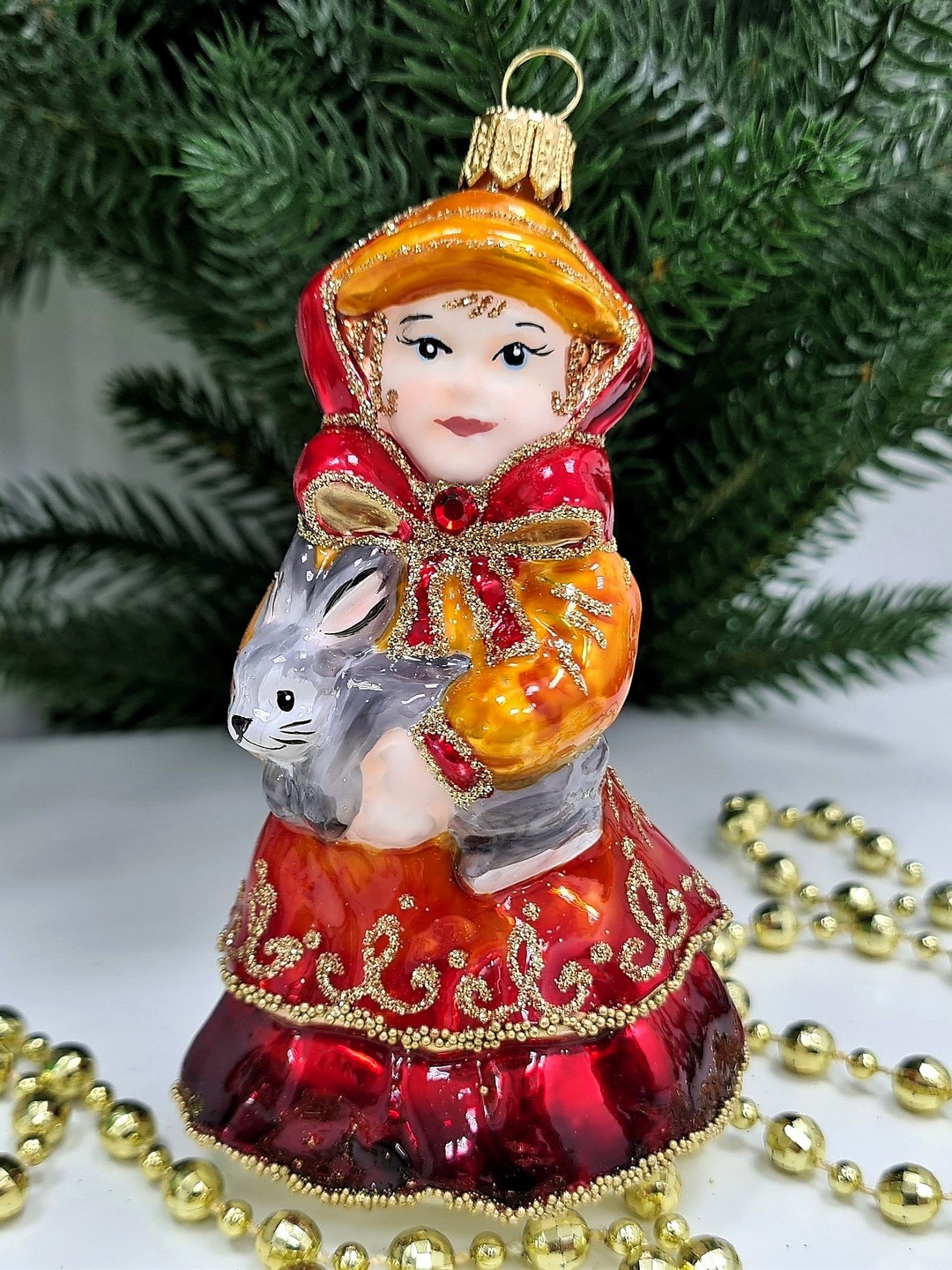 фото Стеклянная елочная игрушка Девочка с кроликом