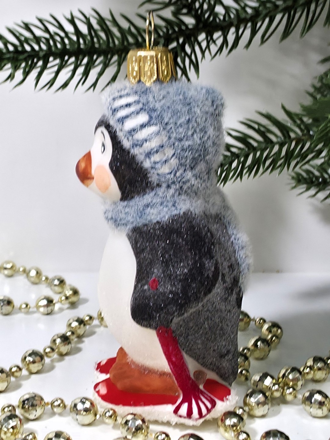 фото Стеклянная елочная игрушка Пингвин на лыжах