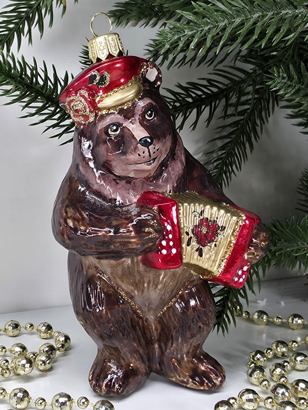 фото Стеклянная елочная игрушка Мишка с гармошкой