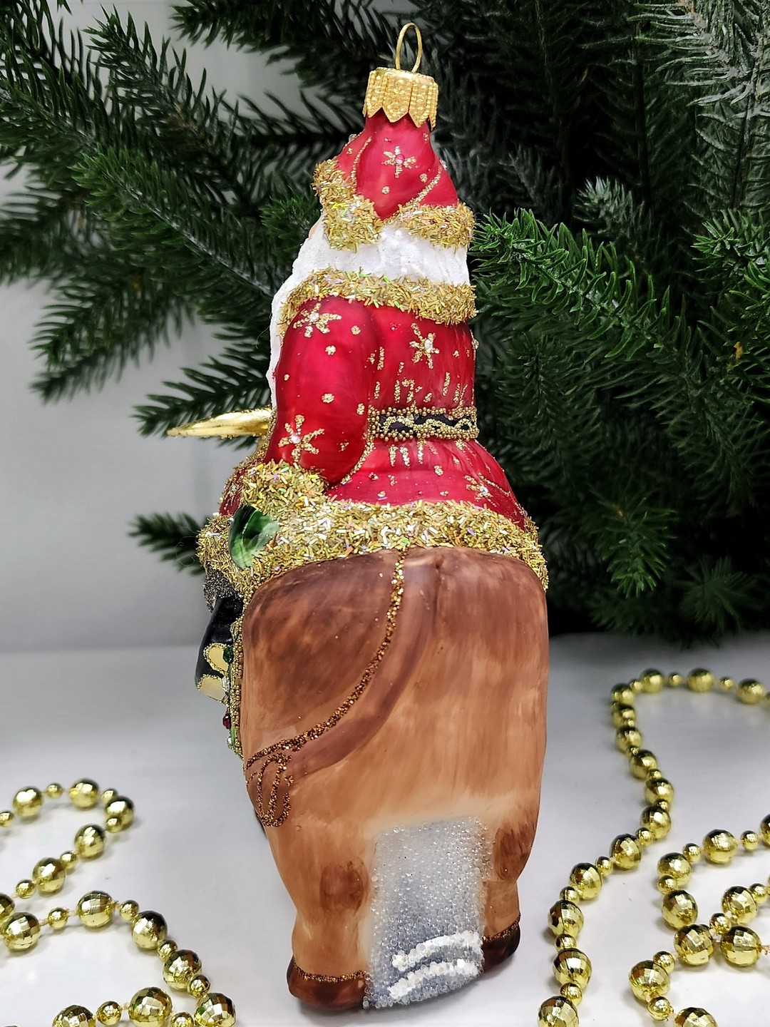 фото Стеклянная елочная игрушка Дед Мороз на быке