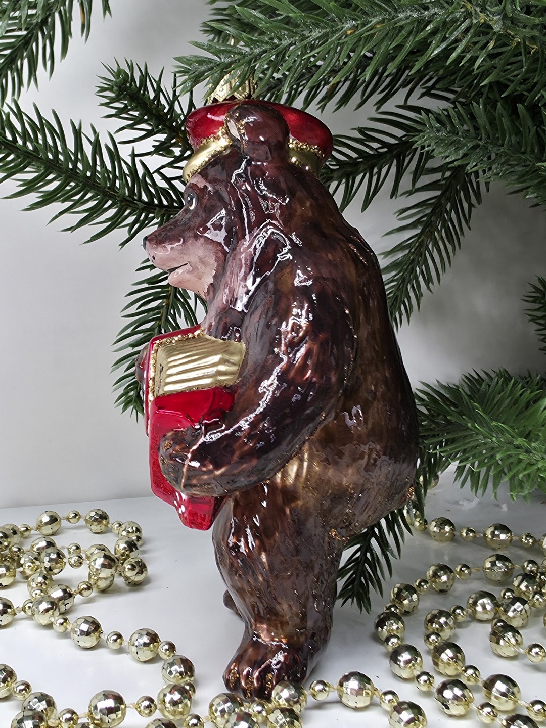 фото Стеклянная елочная игрушка Мишка с гармошкой